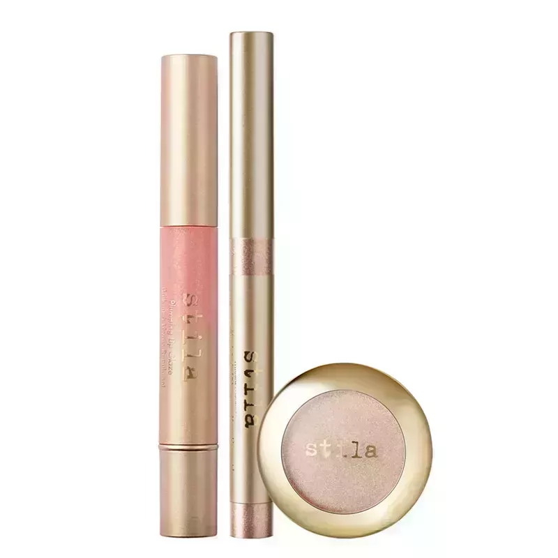 A photo of the Stila Cherished Kitten Eye, Lip & Cheek Set, which includes light pink lip gloss, eye shadow, and multi-use eye, lip, and cheek stick, on a white background