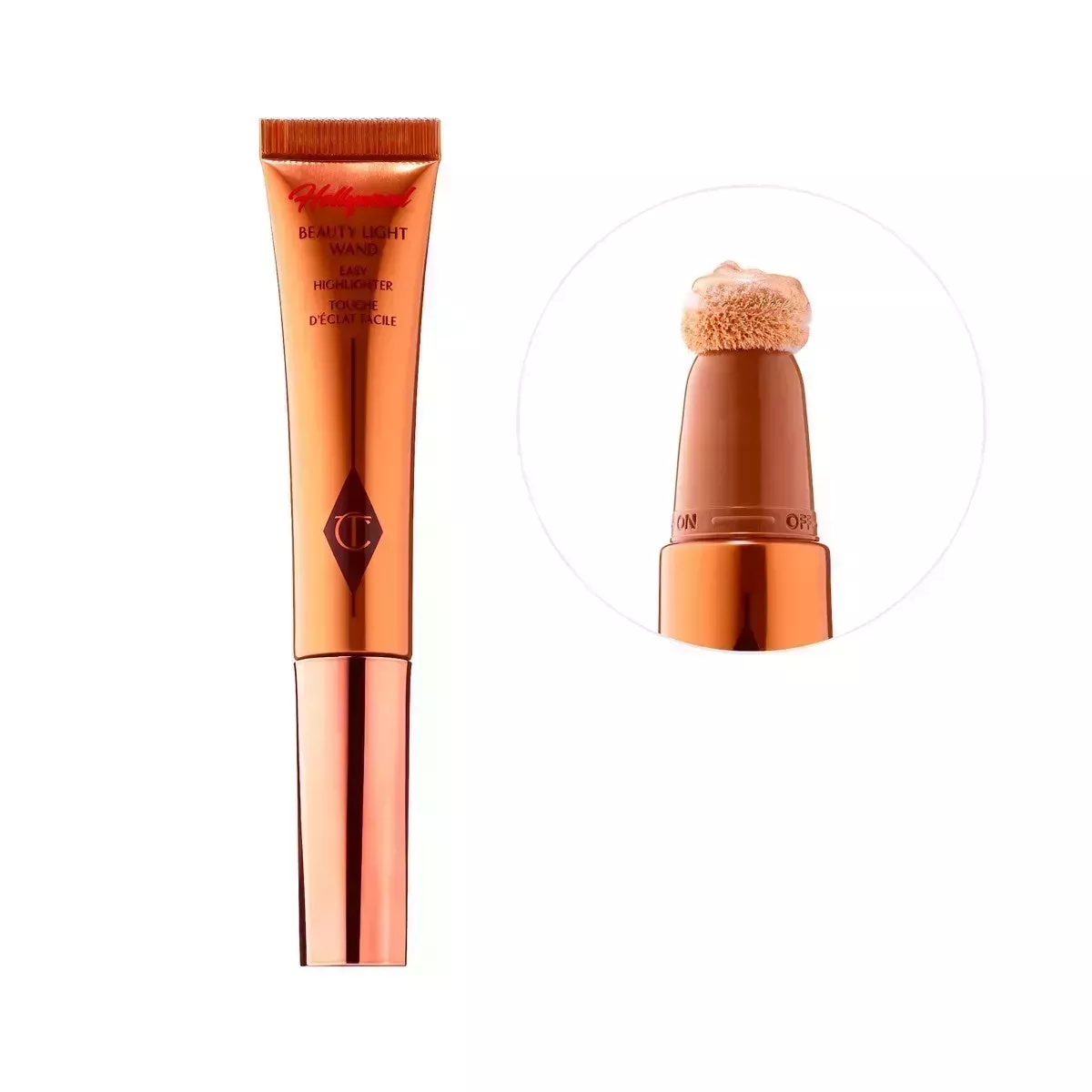A gold makeup tube with a foam tip on a white background