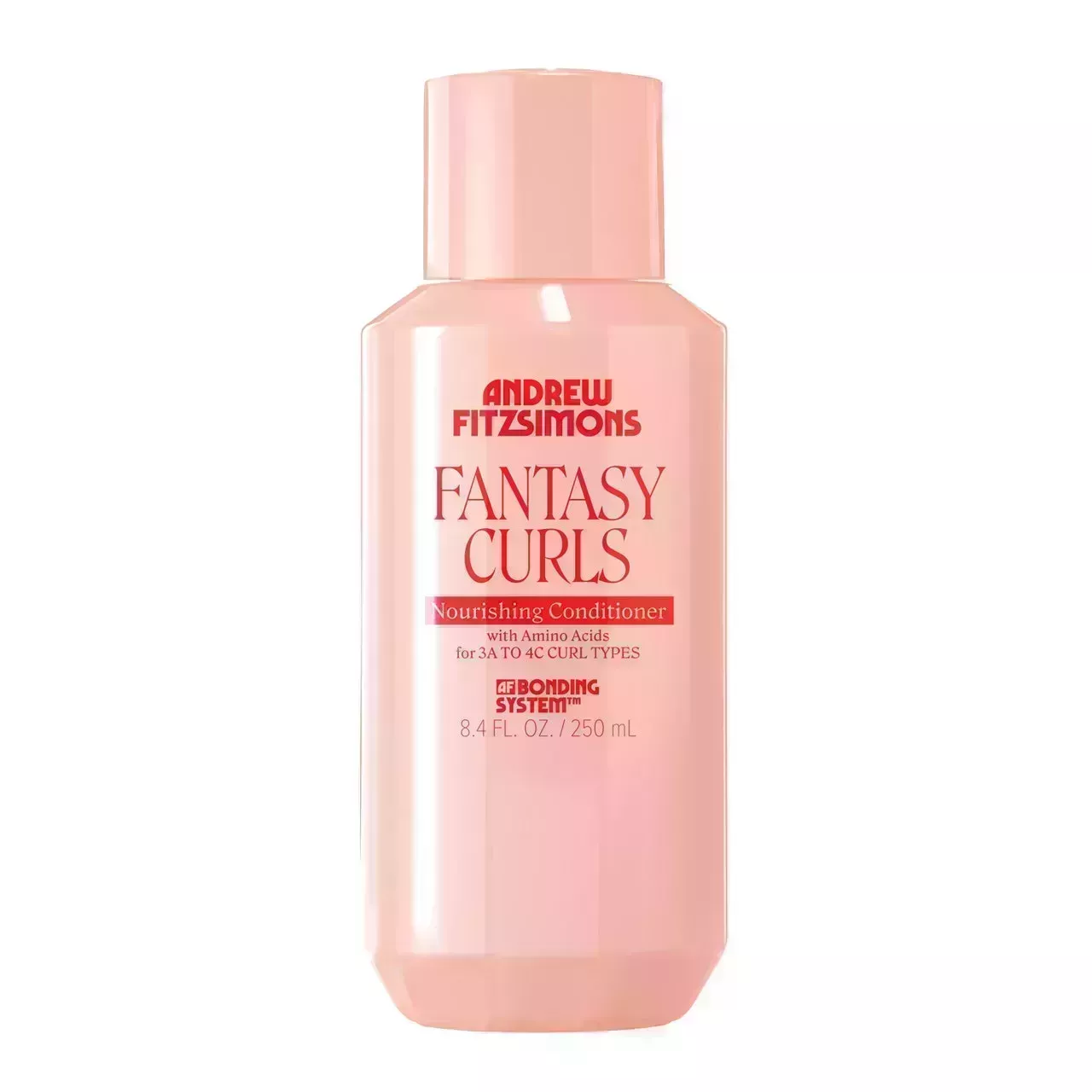 pink bottle of andrew fitzsimons fantasy curls nourishing conditioner with red lettering on white background