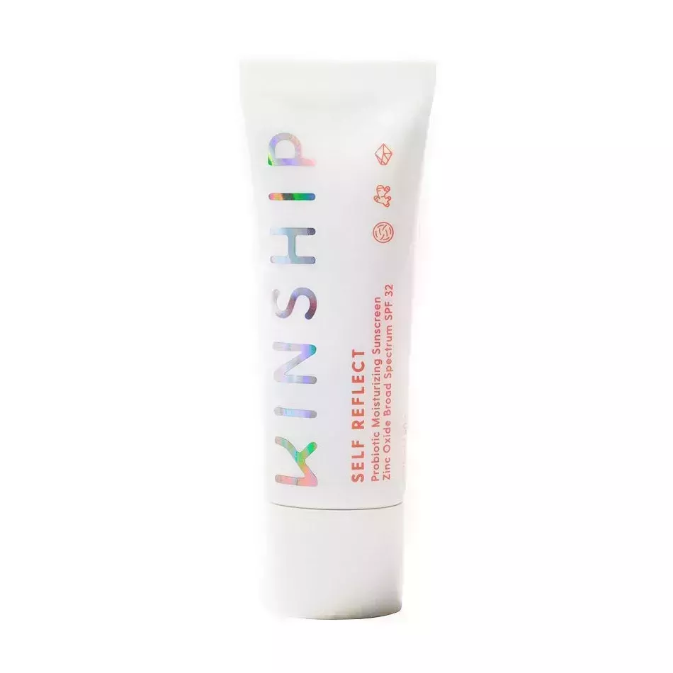 White tube of Kinship Self Reflect Probiotic Moisturizing Sunscreen Zinc Oxide SPF 32 with holographic text label on white background