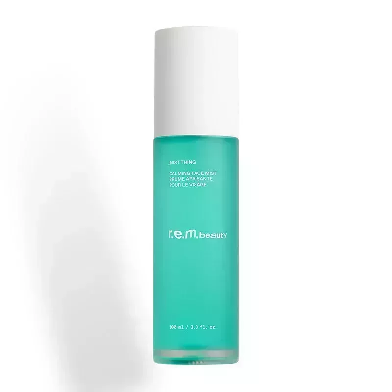 A blue bottle of the r.e.m. beauty Mist Thing Calming Face Mist on a white background