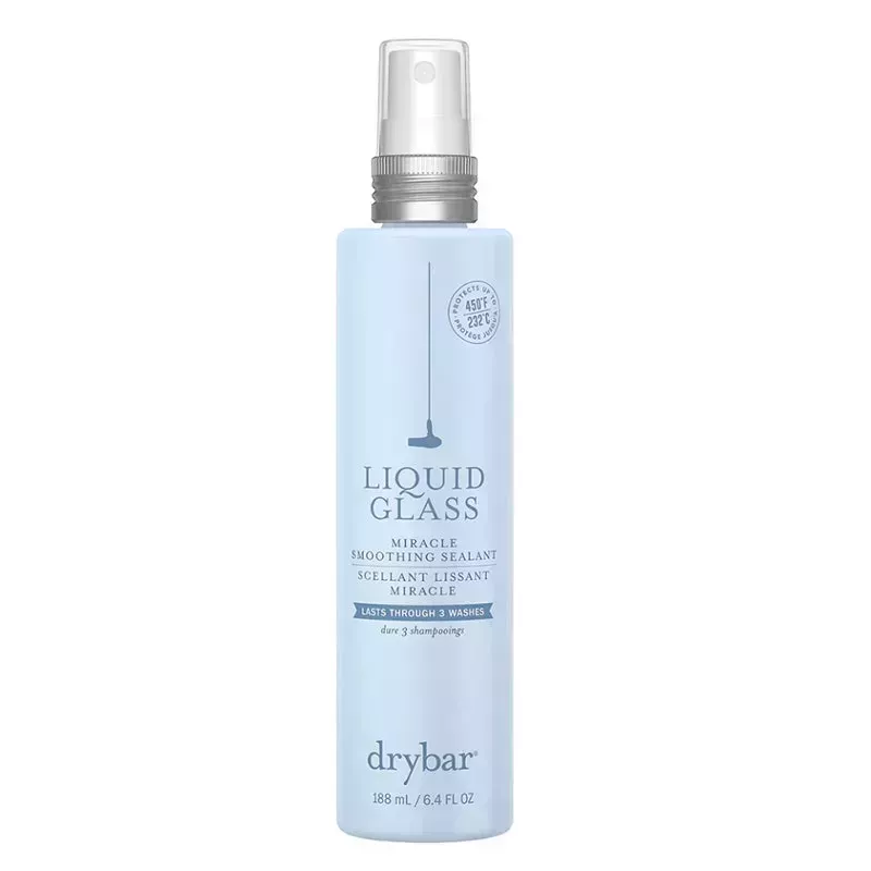 A blue bottle of the Liquid Glass Miracle Smoothing Sealant from Drybar on a white background