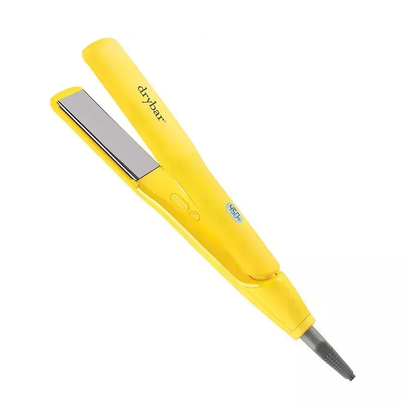 The yellow Drybar The Tress Press Straightening Iron hair flat iron on a white background