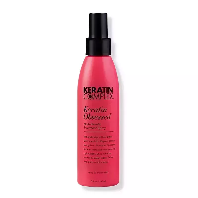 A red bottle of the Keratin Complex Keratin Obsessed Multi-Benefit Treatment Spray on a white background