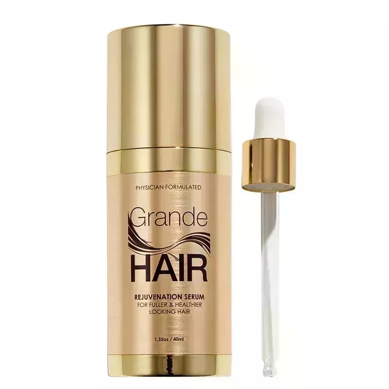 A gold bottle of the Grande Cosmetics GrandeHair Enhancing Serum on a white background