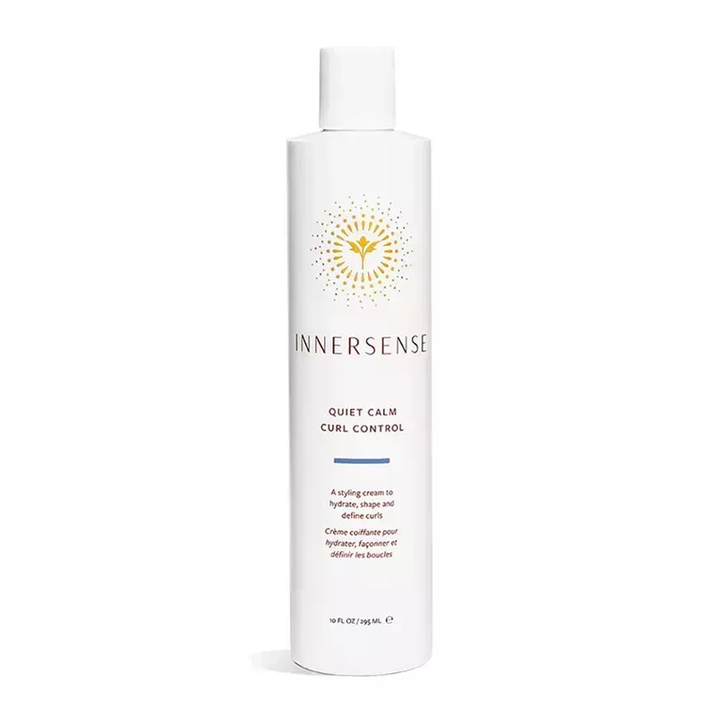 A white bottle of the Innersense Quiet Calm Curl Control on a white background