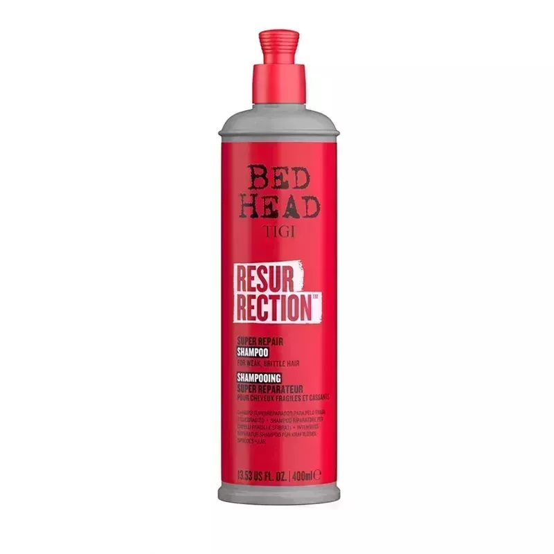 A red bottle of the Bed Head Resurrection Super Repair Shampoo on a white background