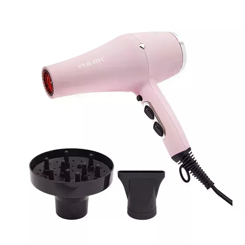 The pink Eva NYC Spectrum Far-Infrared Dryer with two black blow dryer attachments (diffuser and nozzle) on a white background