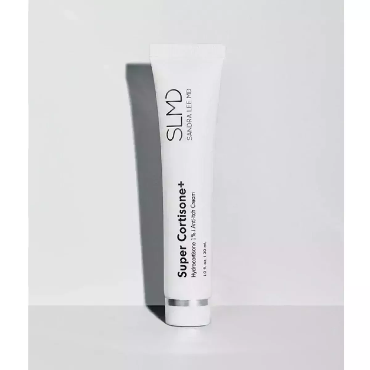 A white tube with black lettering on a white background