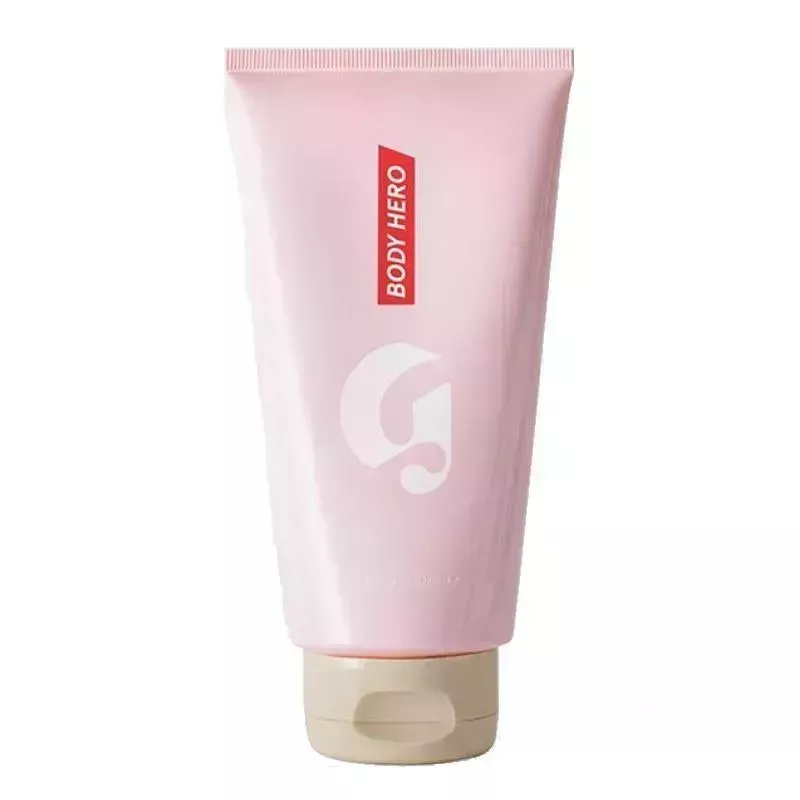 A pink tube of Body Hero Daily Perfecting Cream on white background