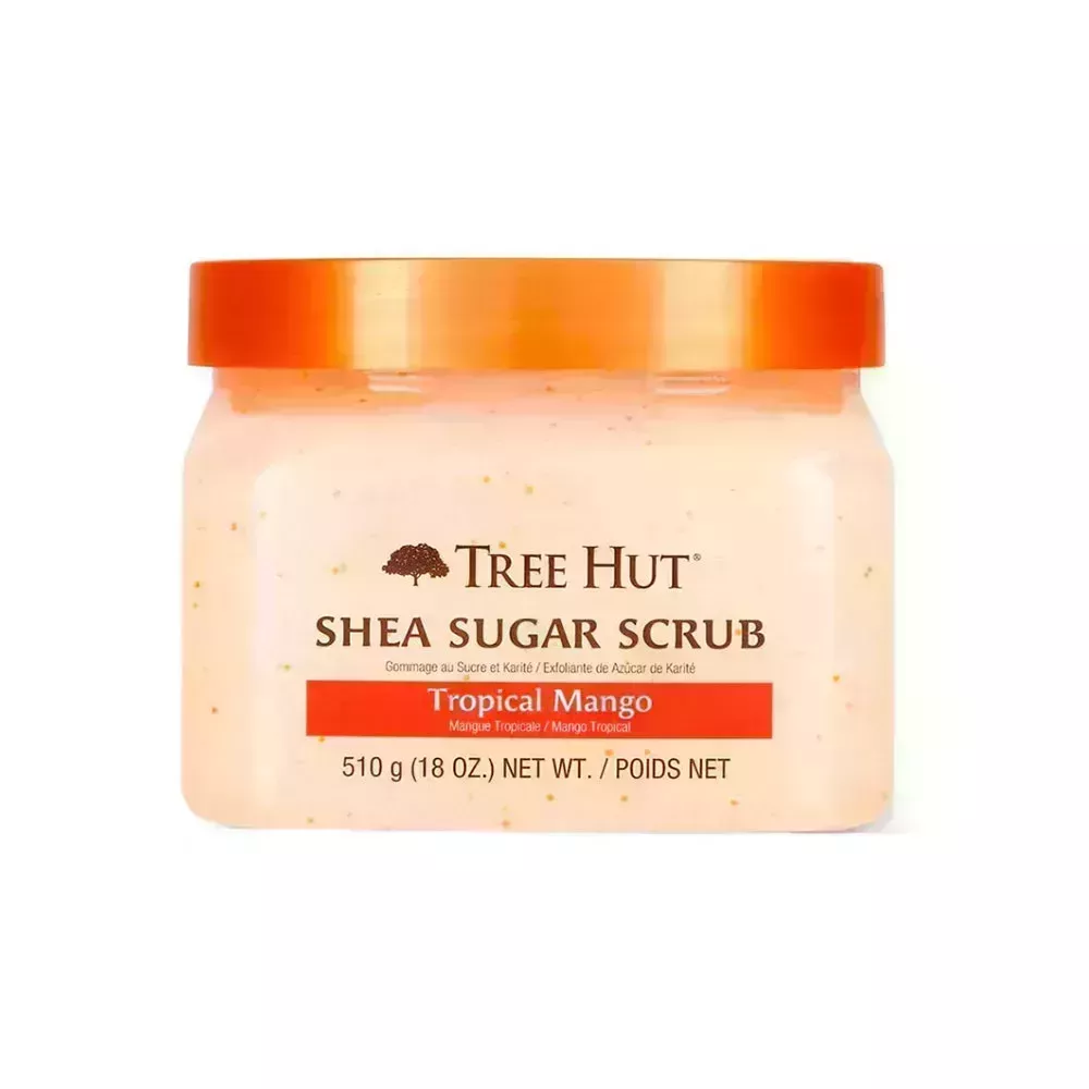 Tree Hut Shea Sugar Scrub Tropical Mango jar of pale orange speckled scrub with orange lid on white background