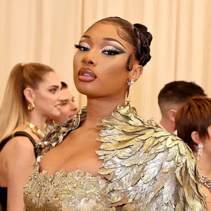 megan thee stallion posing with dramatic silver cut crease at met gala 
