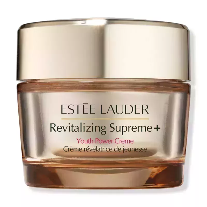 A gold jar with matching cap of the Estée Lauder Revitalizing Supreme+ Youth Power Crème on a white background