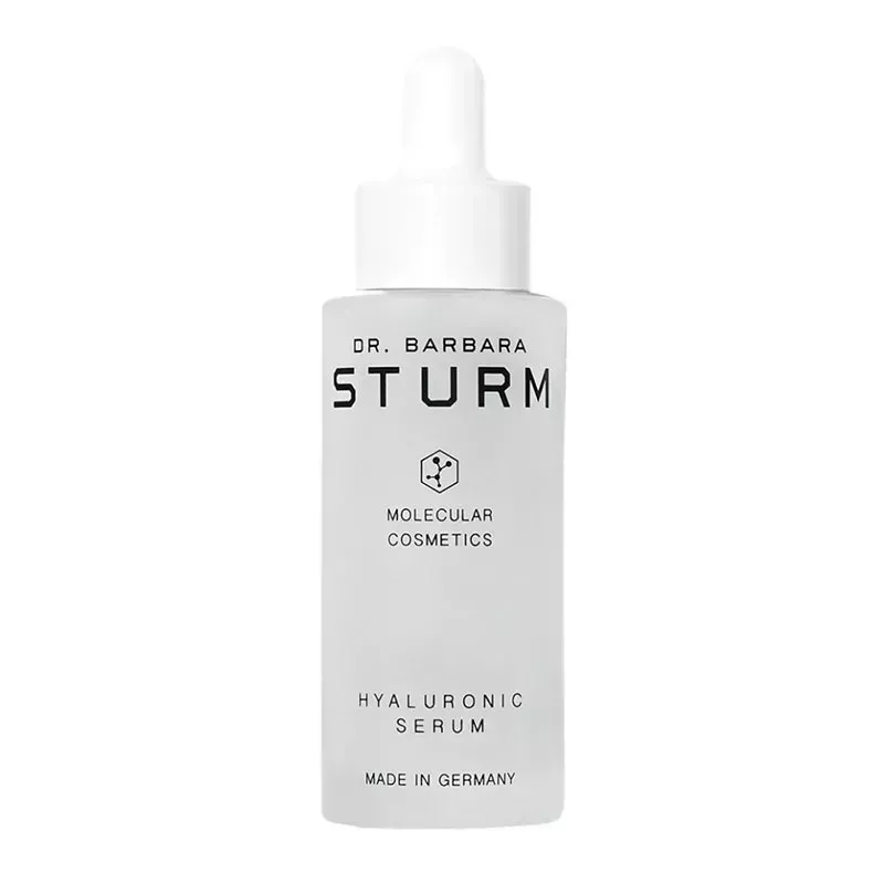 A clear frosted glass bottle of the Dr. Barbara Sturm Hyaluronic Serum on a white background
