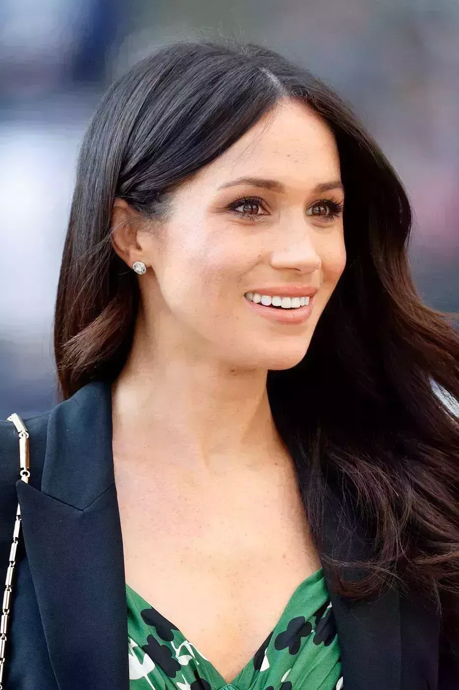 a photo of megan markle with glowing skin, one of good housekeeping's royal beauty hacks