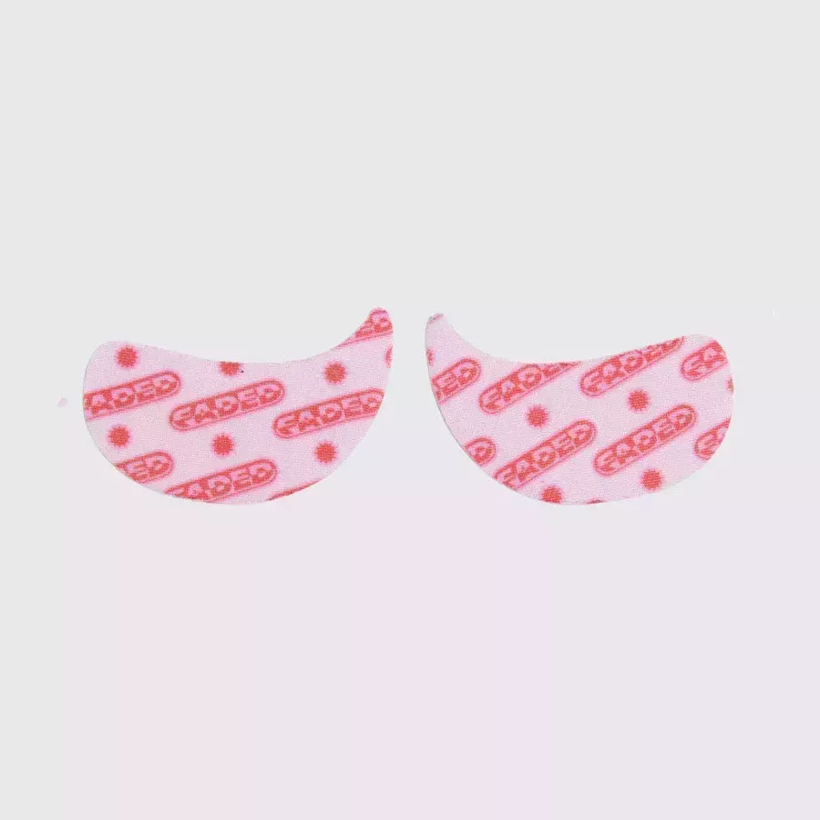 Topicals Faded Under Eye Masks pink under eye masks on gray background