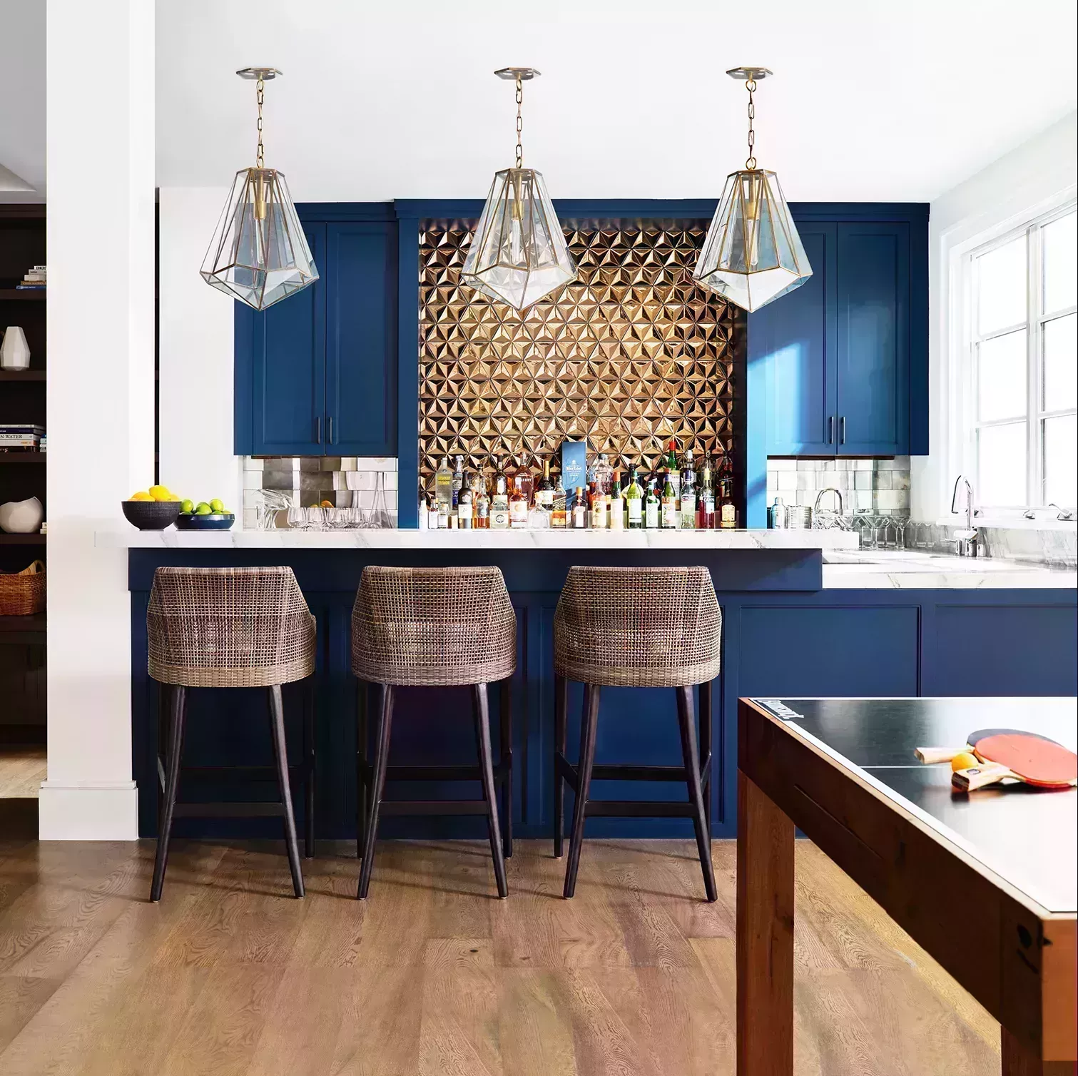 home bar idea, blue cabinets and gold backsplash