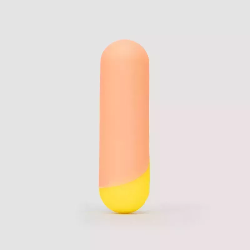 The orange and yellow Romp Riot Bullet Vibrator sex toy on a gray background