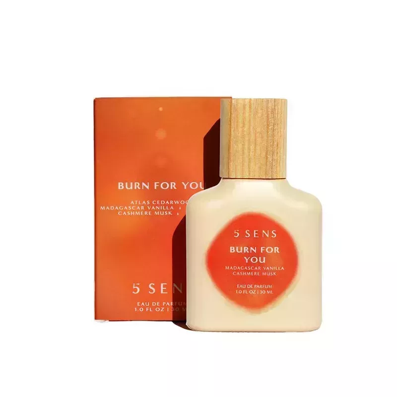 A beige perfume bottle of the 5Sens Burn For You Eau de Parfum on a white background