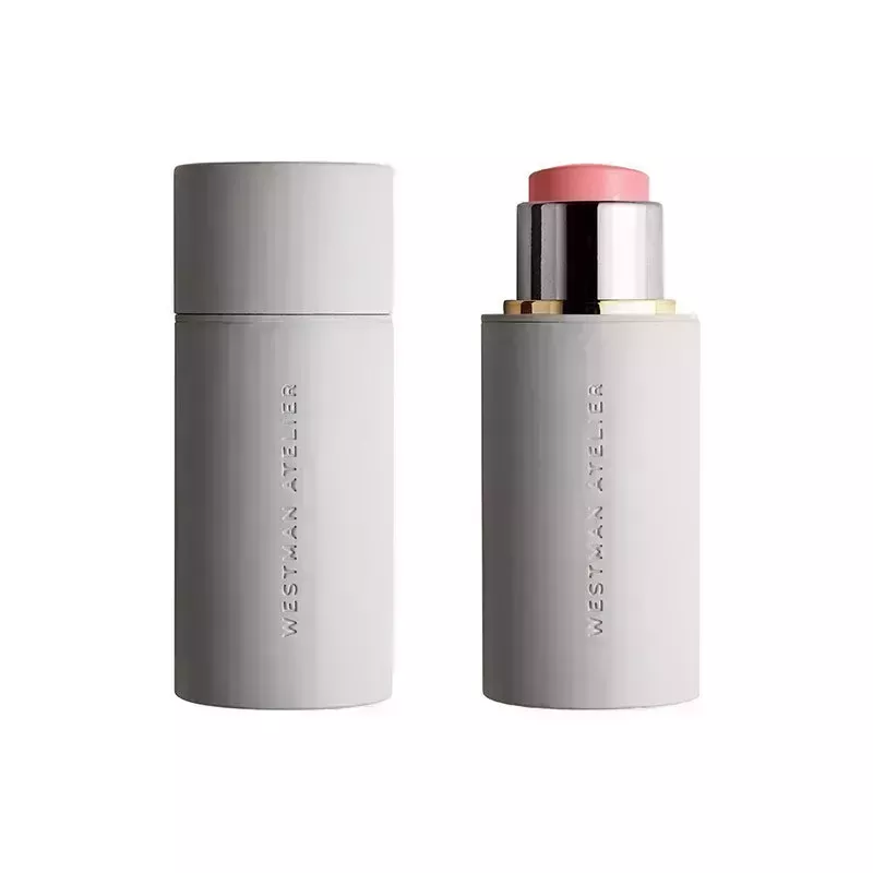 A gray tube of the pink Westman Atelier Baby Cheeks Blush Stick on a white background