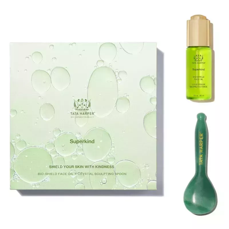 Soothe & Sculpt Set green face oil, gua sha, and light green box on white background