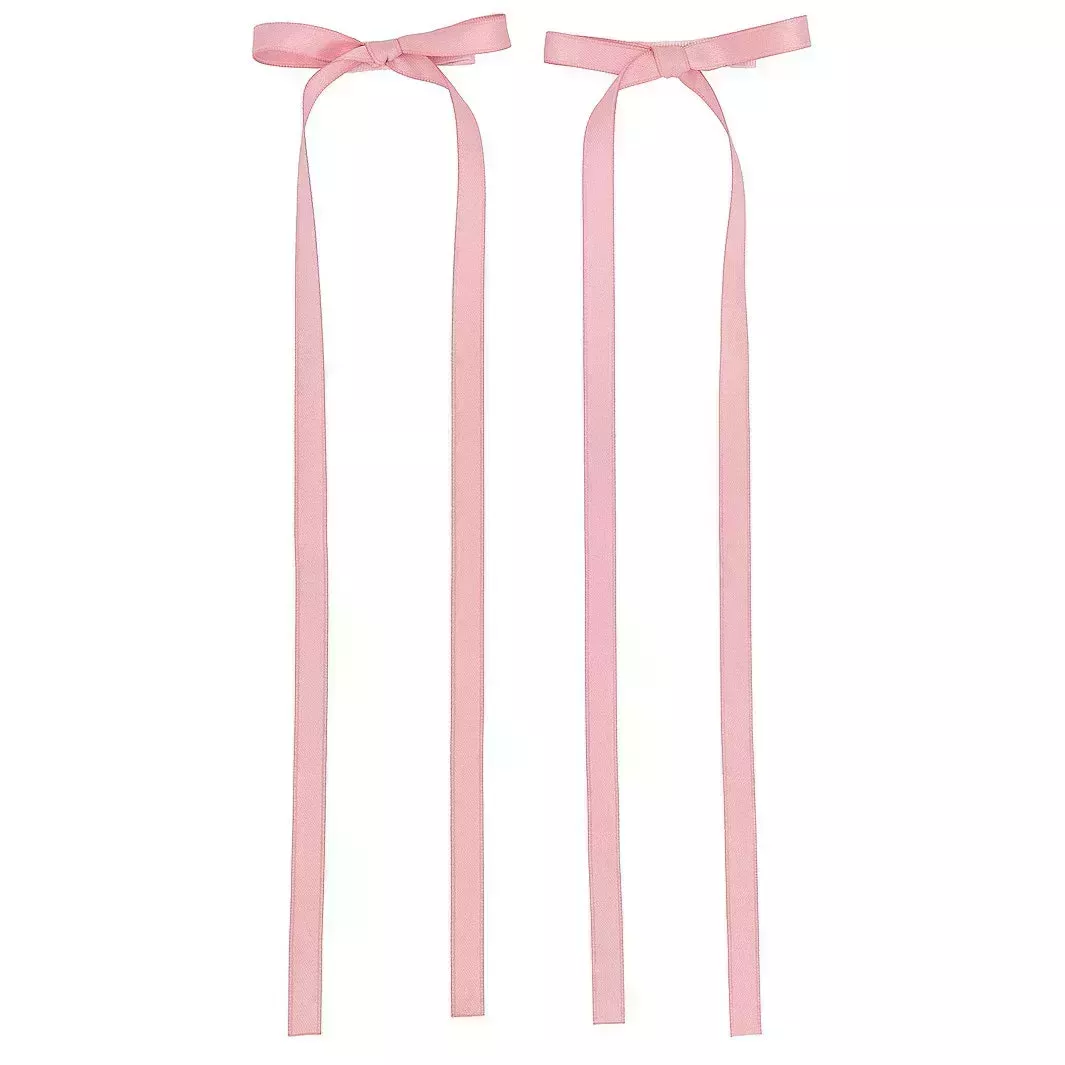 Shashi Amy Rosette Set Of 2 in Pink two long thin pink bow clips on white background