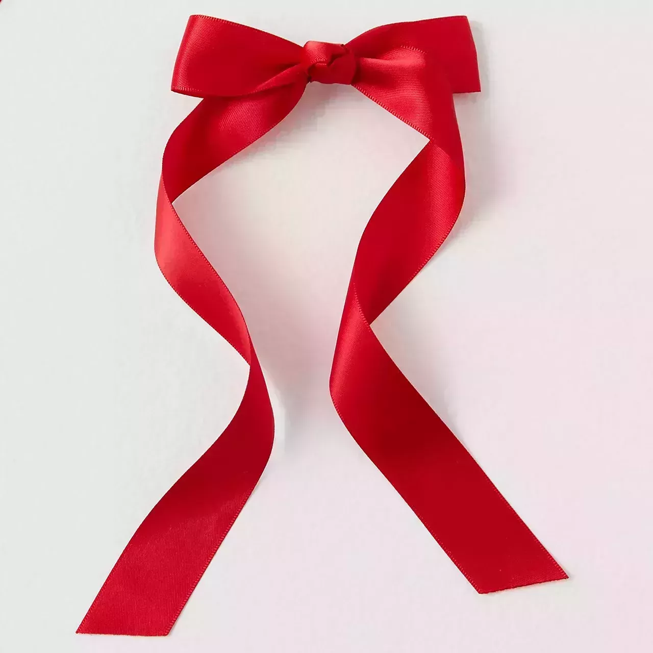 Free People Petite Bow red ribbon bow on gray background