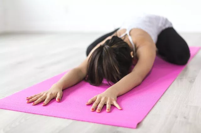 https://www.pexels.com/photo/woman-doing-yoga-pose-on-pink-yoga-mat-374589/