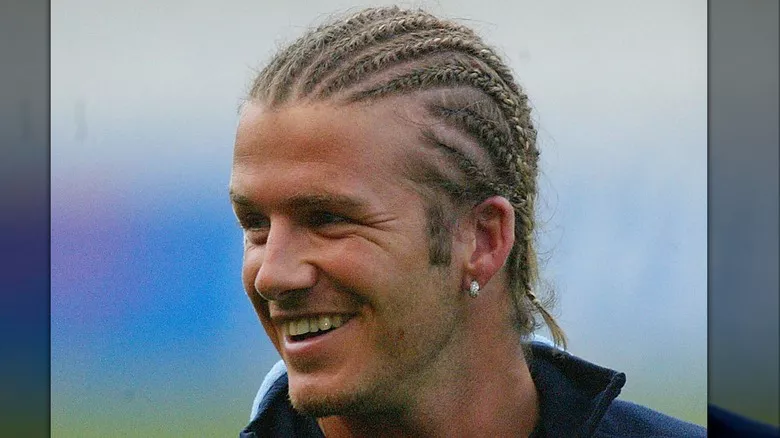 David Beckham smiling with cornrows in 2003